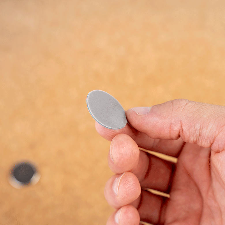 GIF Attaching a magnet to a tin holder 